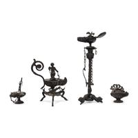 A Collection of Four Patinated Bronze Oil Lamps