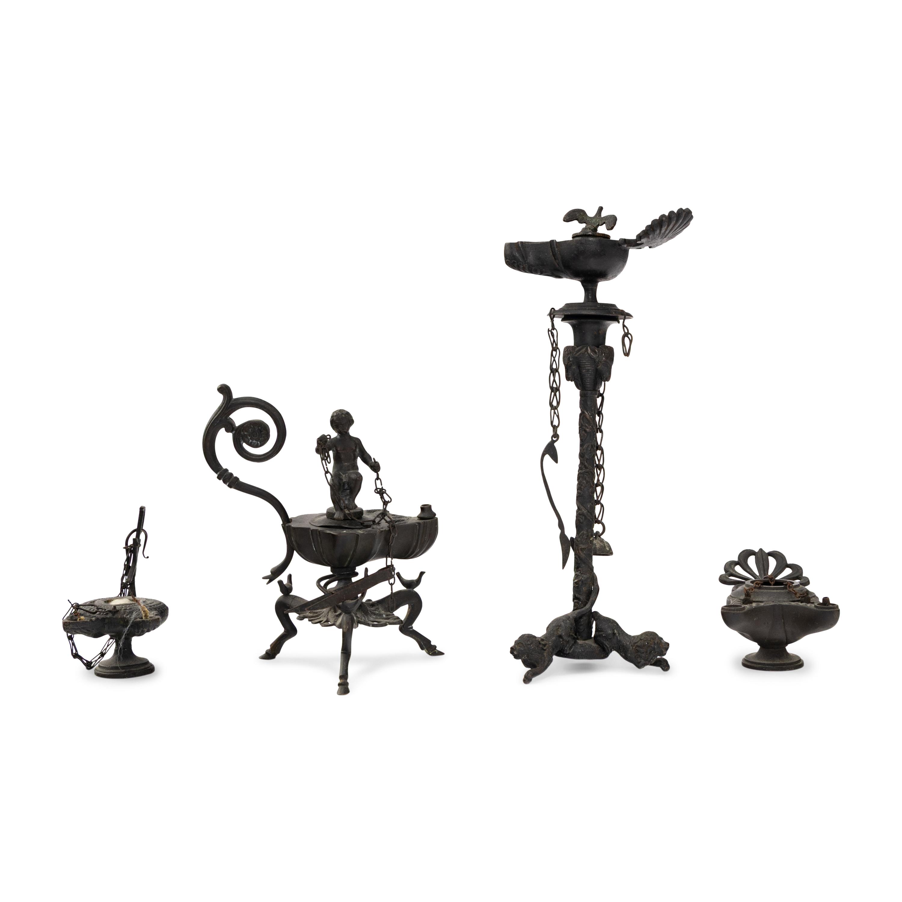 A Collection of Four Patinated Bronze Oil Lamps