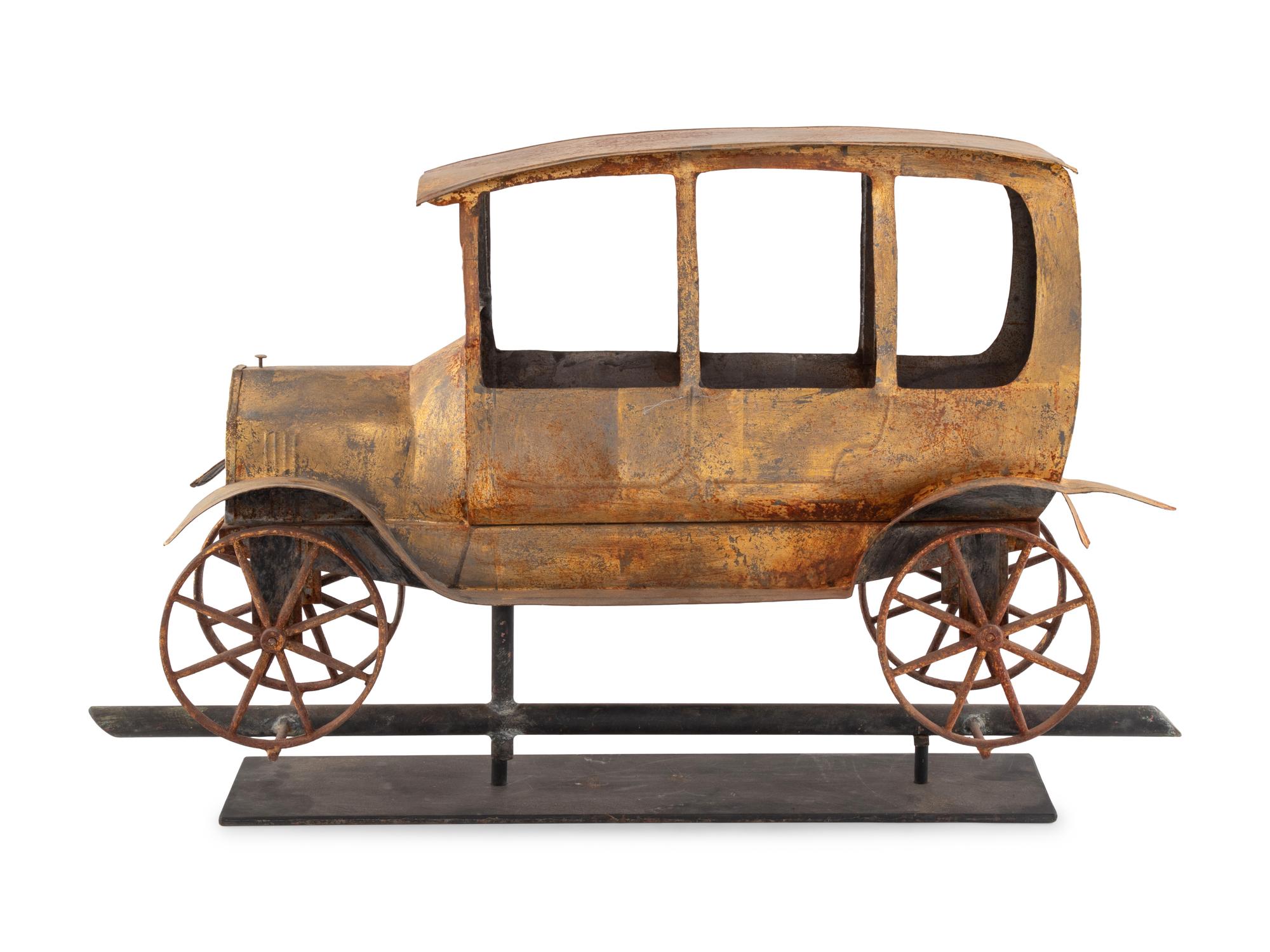 A Gilt, Cut, and Pressed Sheet Metal Automobile Weathervane