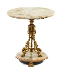 A Neoclassical Gilt Metal and Onyx Occasional Table, Height 19 x diameter 18 inches.