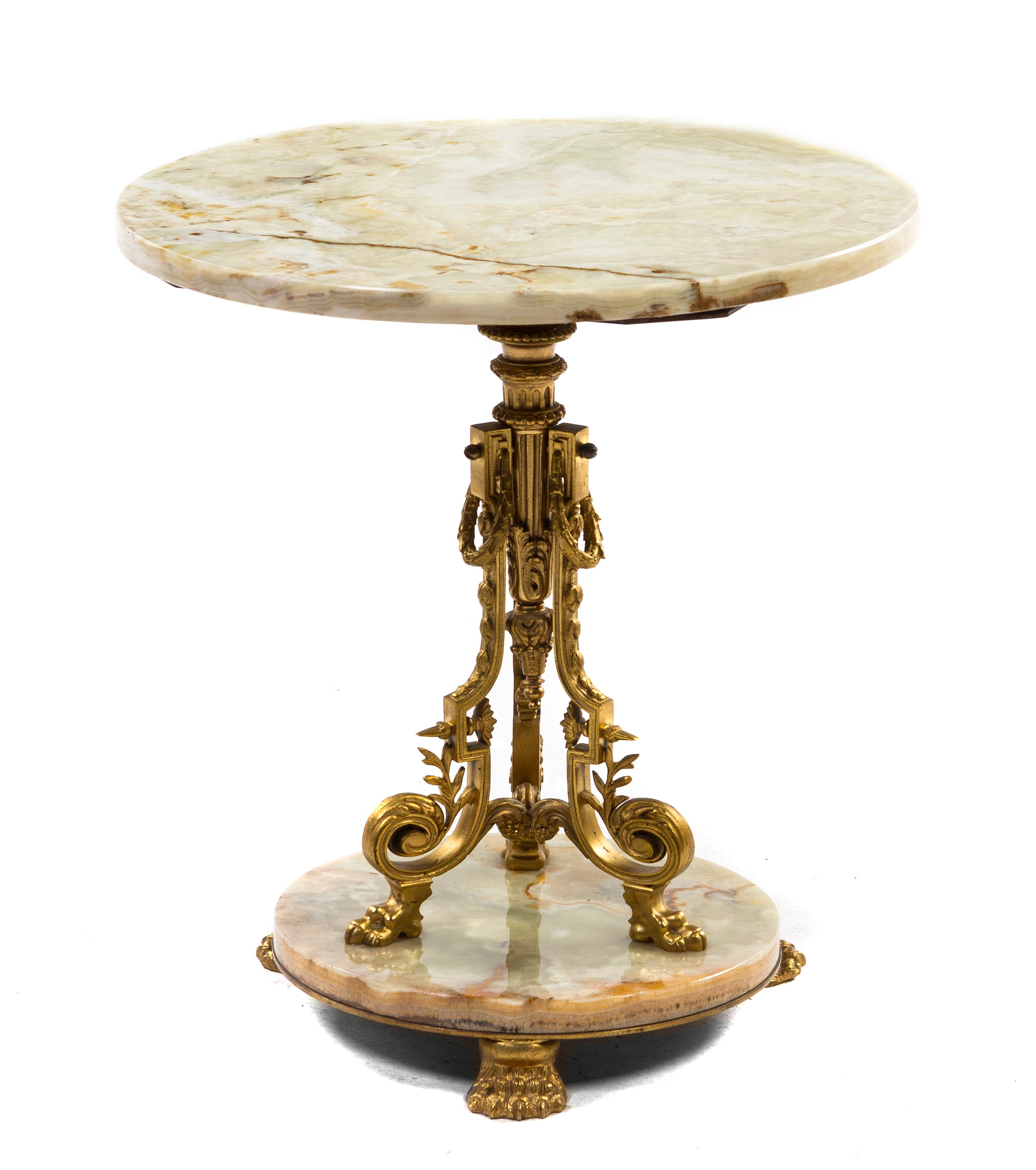 A Neoclassical Gilt Metal and Onyx Occasional Table, Height 19 x diameter 18 inches.