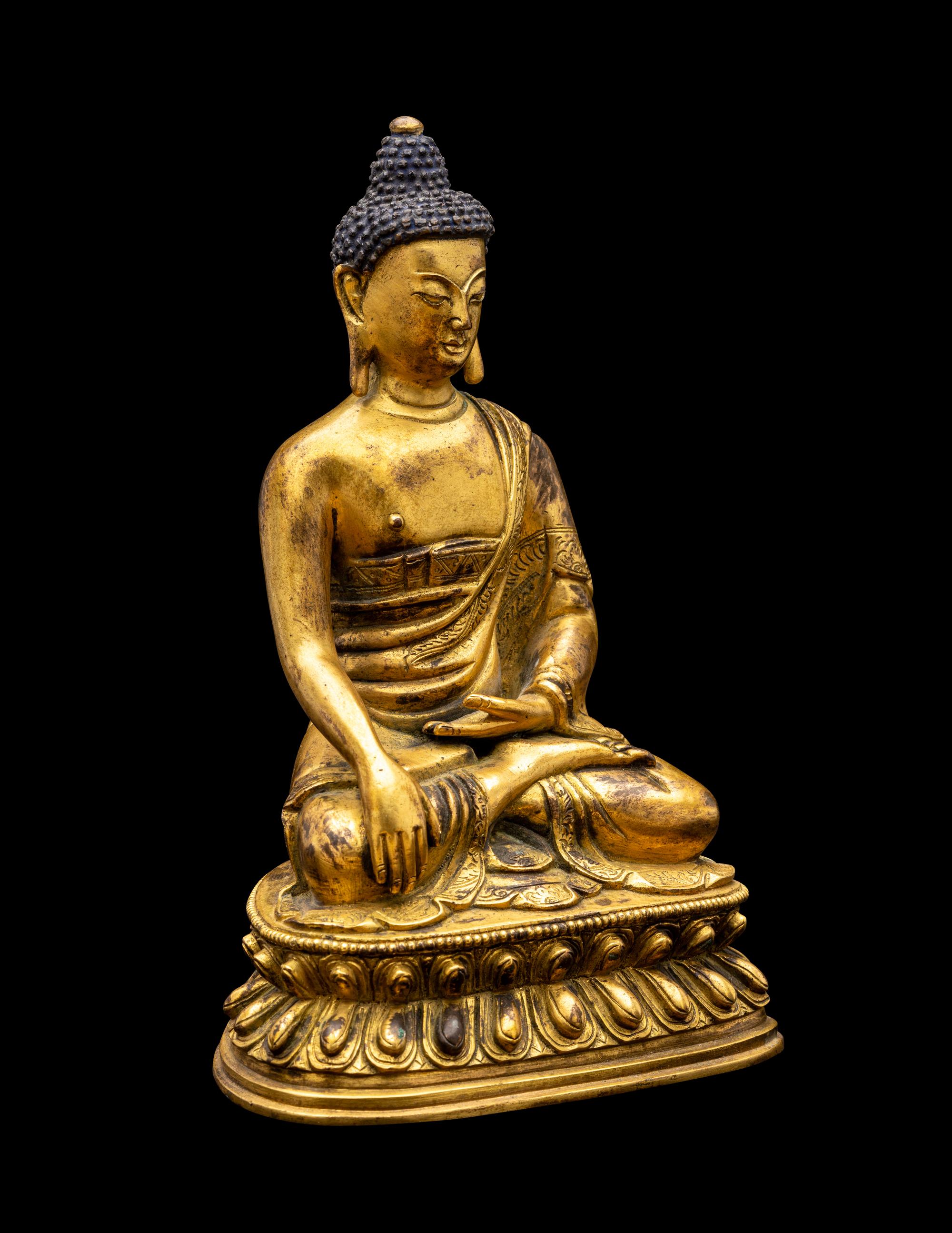 A Sino-Tibetan Gilt Bronze Figure of Seated Buddha