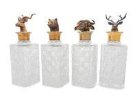 A Set of Four English Silver Mounted Cut-Glass Decanters