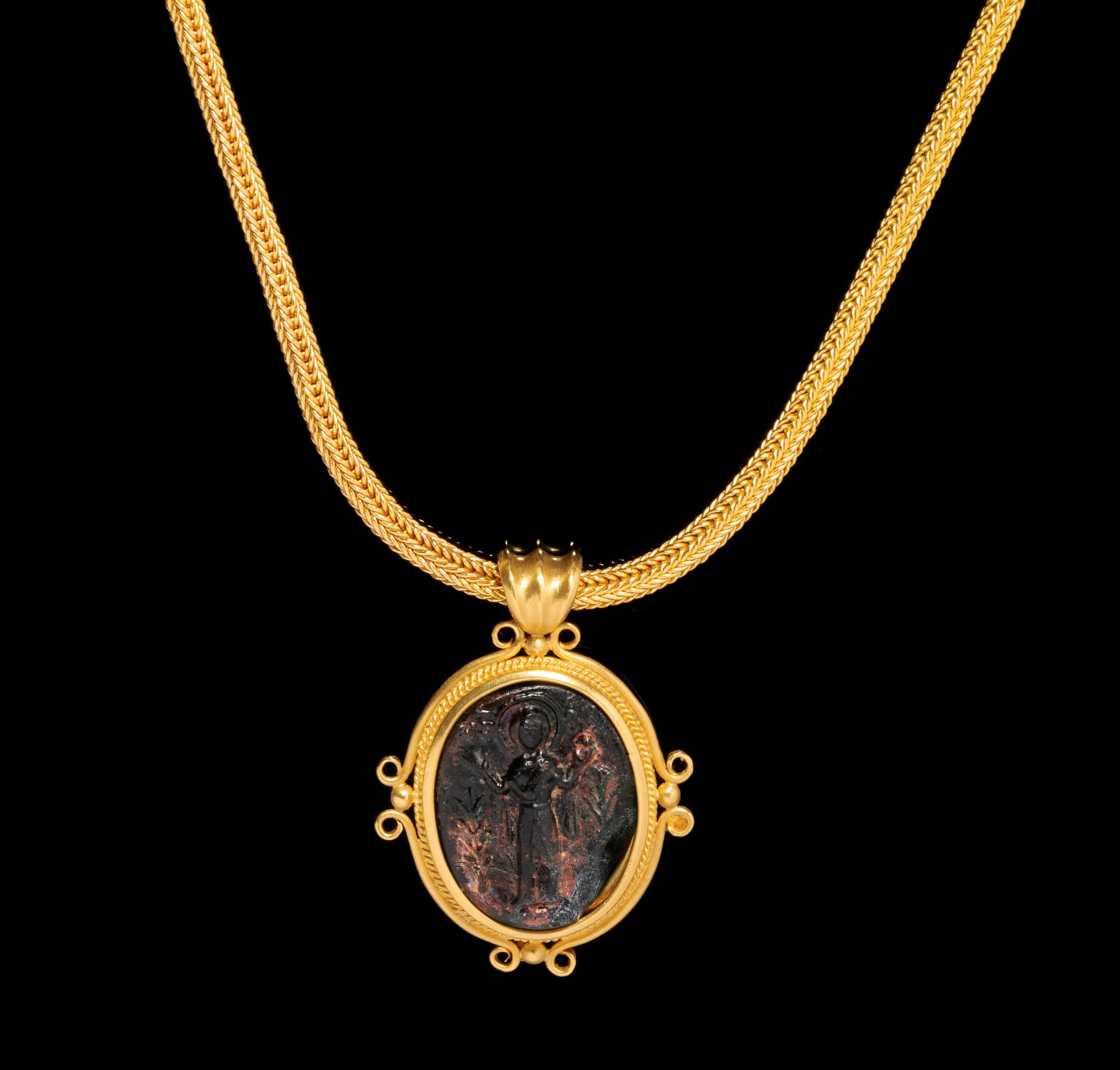 A Byzantine Gold Necklace with Molded Green Glass Cameo