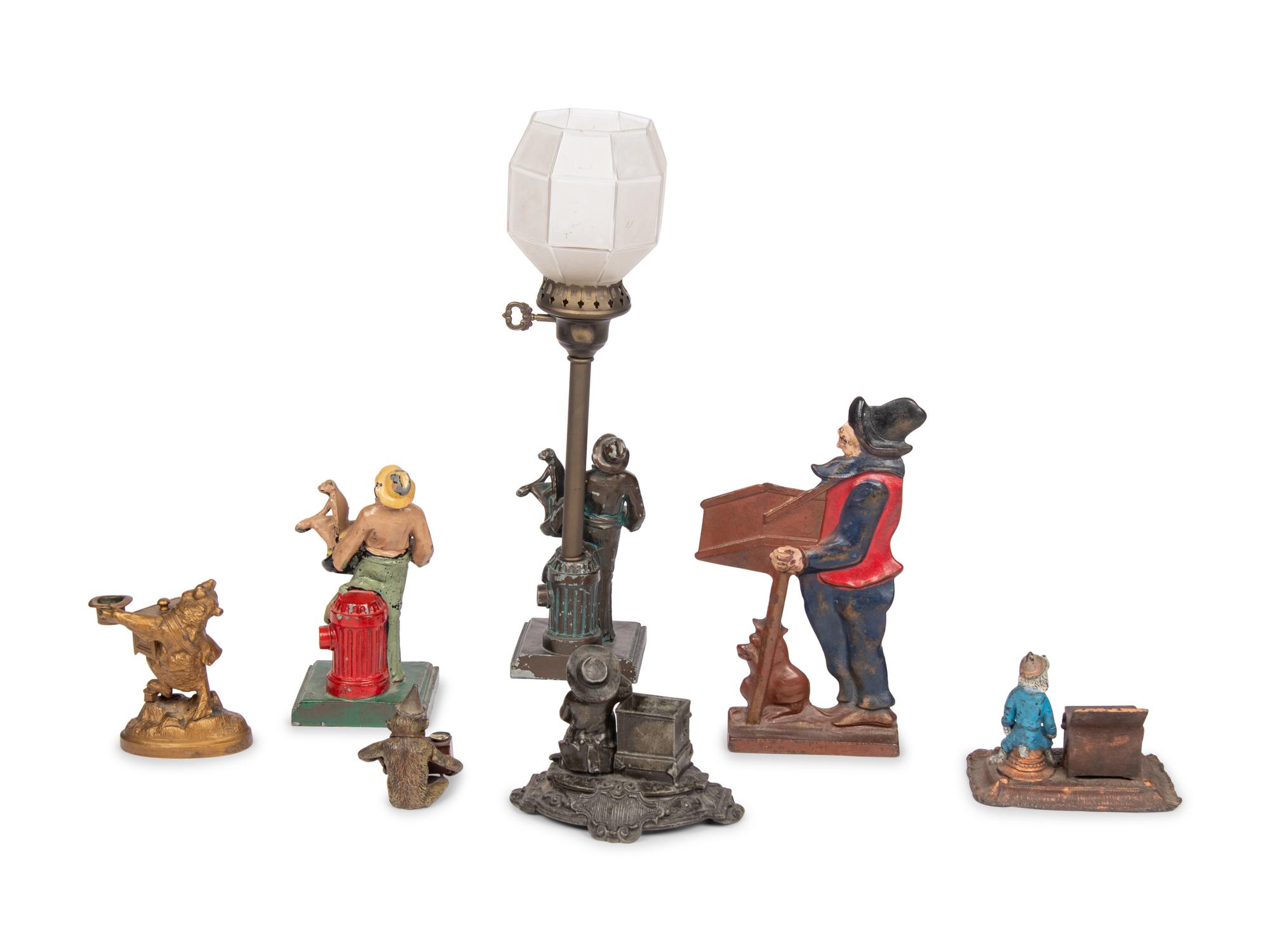 A Group of Seven Barrel Organ Themed Metal Items