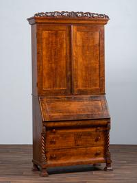 A Classical Style Carved and Highly Figured Tiger Maple Slant Front Desk