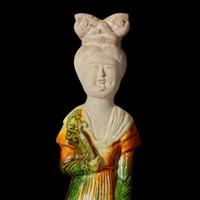 A Chinese sancai-glazed pottery figure of a seated woman 唐三彩仕女坐像 Tang dynasty ?