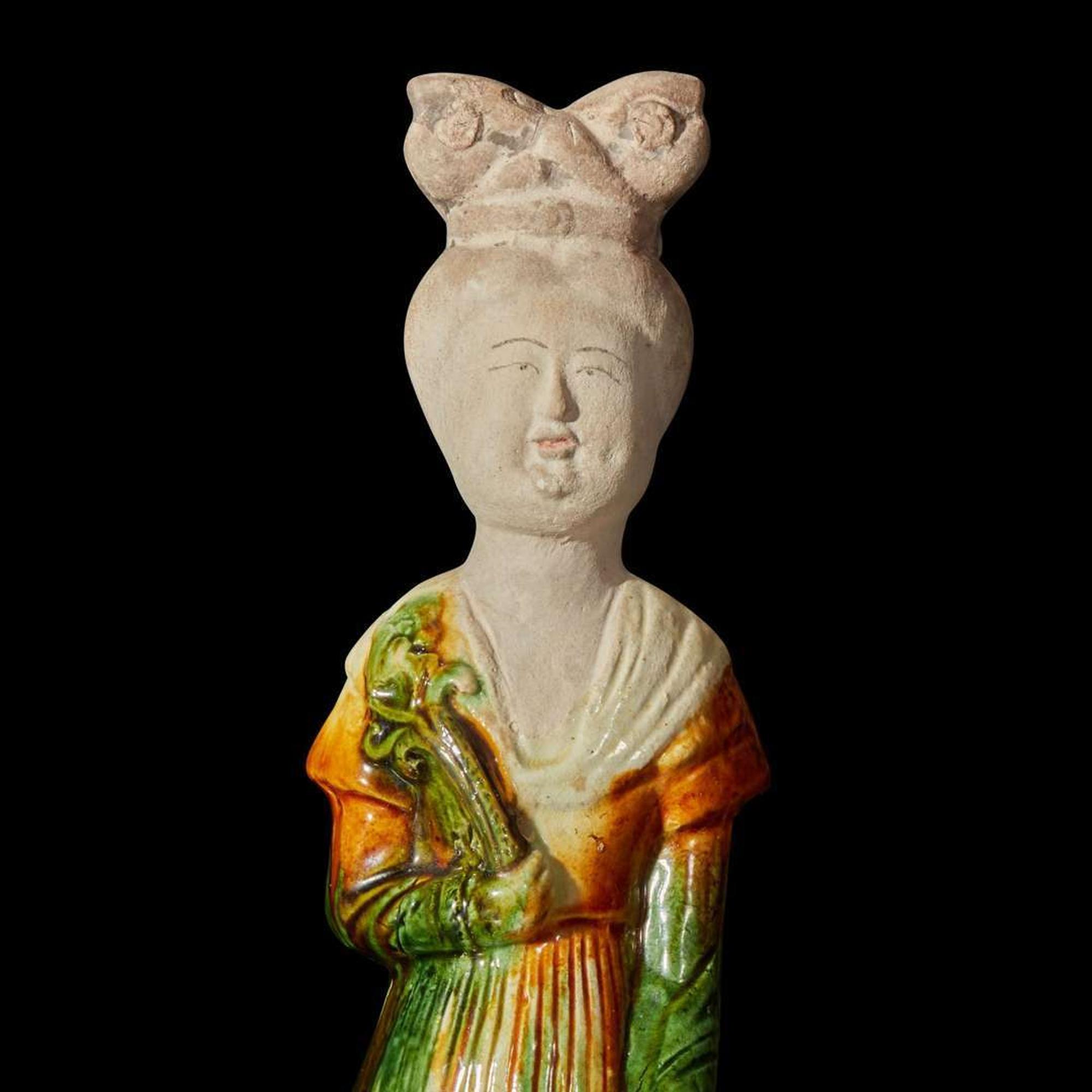 A Chinese sancai-glazed pottery figure of a seated woman 唐三彩仕女坐像 Tang dynasty ?