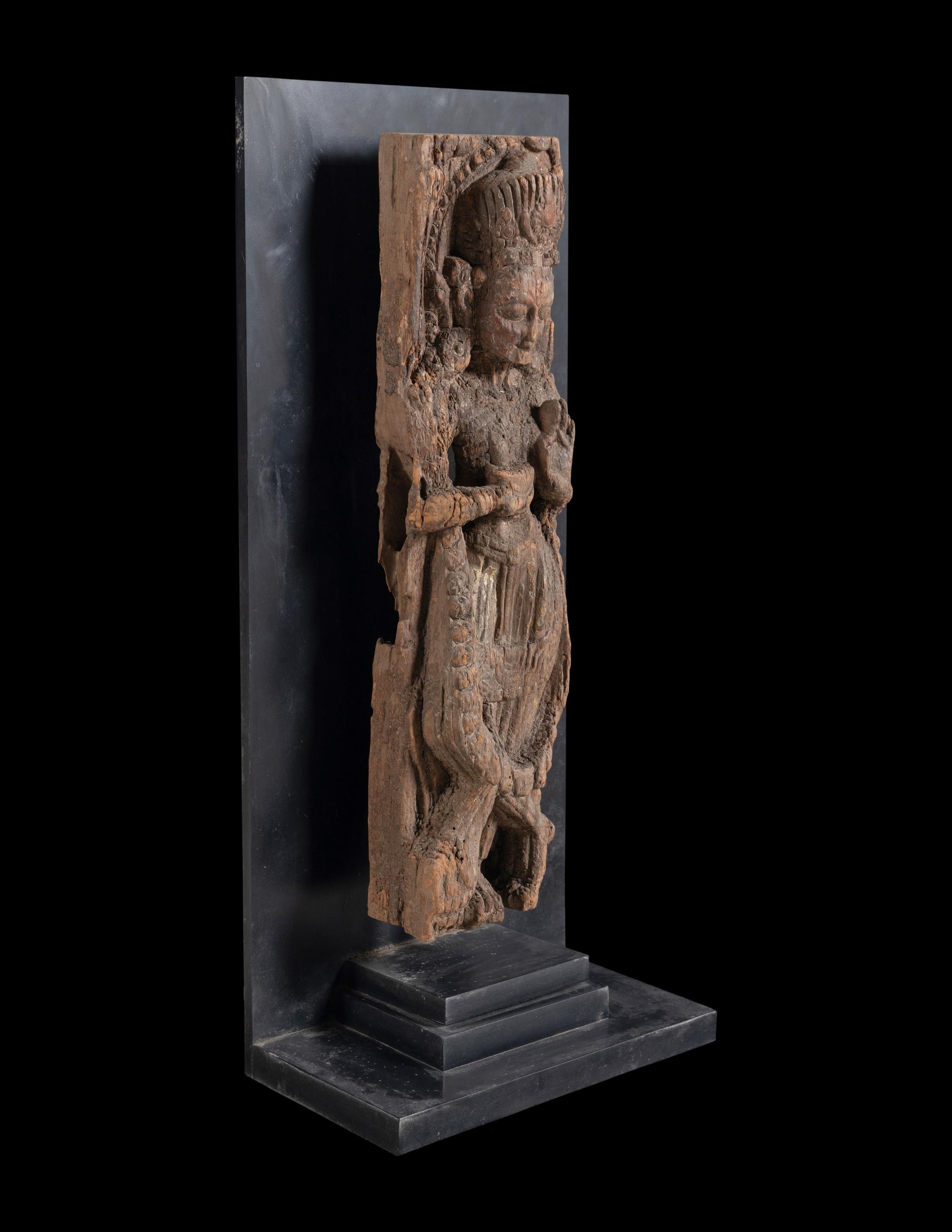 An Indian Carved Wood Figure of a Deity