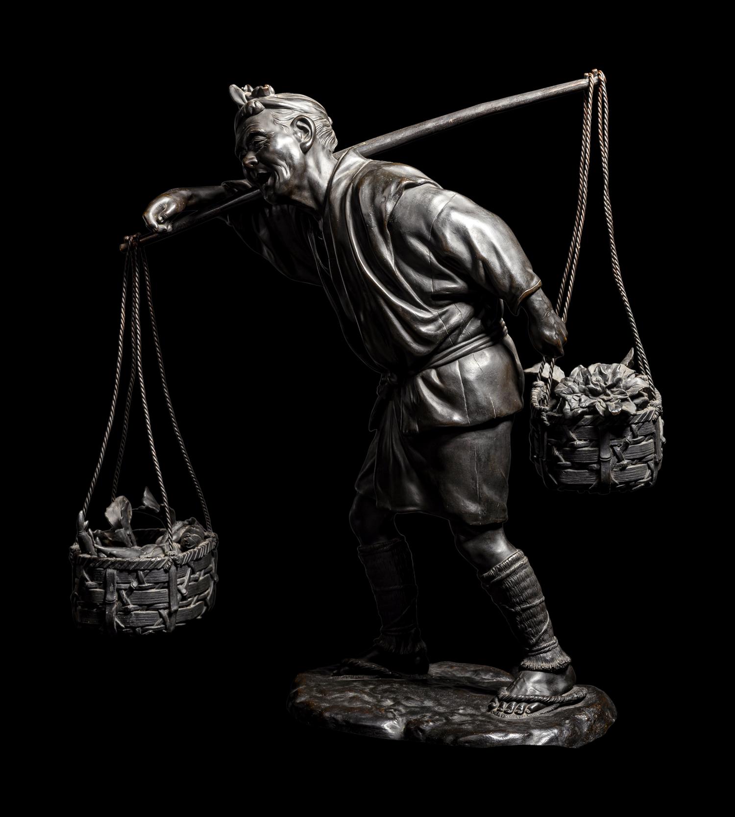 A Large Bronze Okimono of a Man