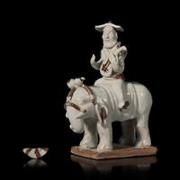 A Chinese Hutian Spotted Qingbai Glazed Porcelain Foreign Musicians Riding an Elephant — 湖田窯青白釉胡人琵琶騎象俑