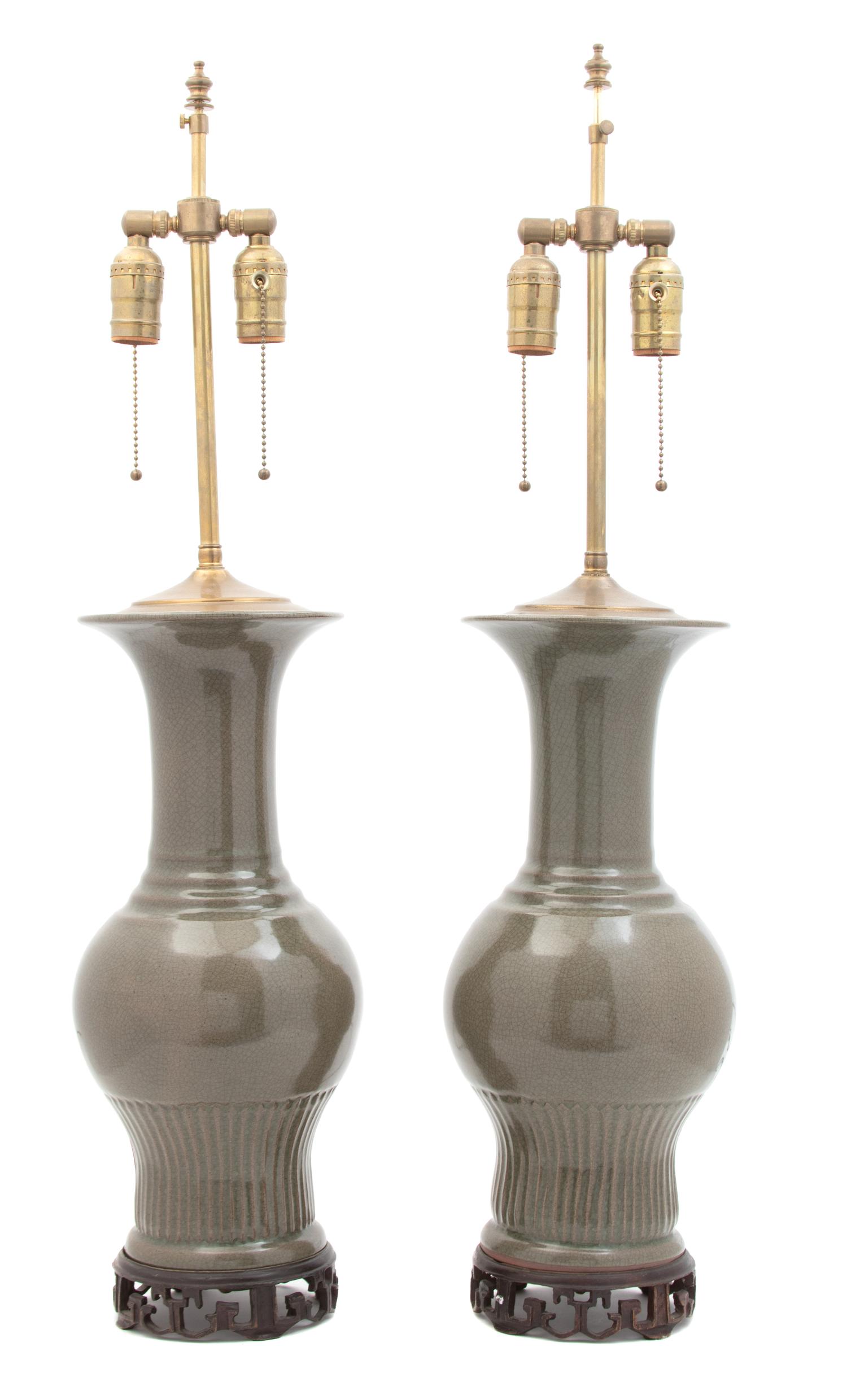 A Pair of Chinese Crackle Glazed Porcelain Vases Mounted as Lamps Height overall 33 1/2 inches. — 20TH CENTURY