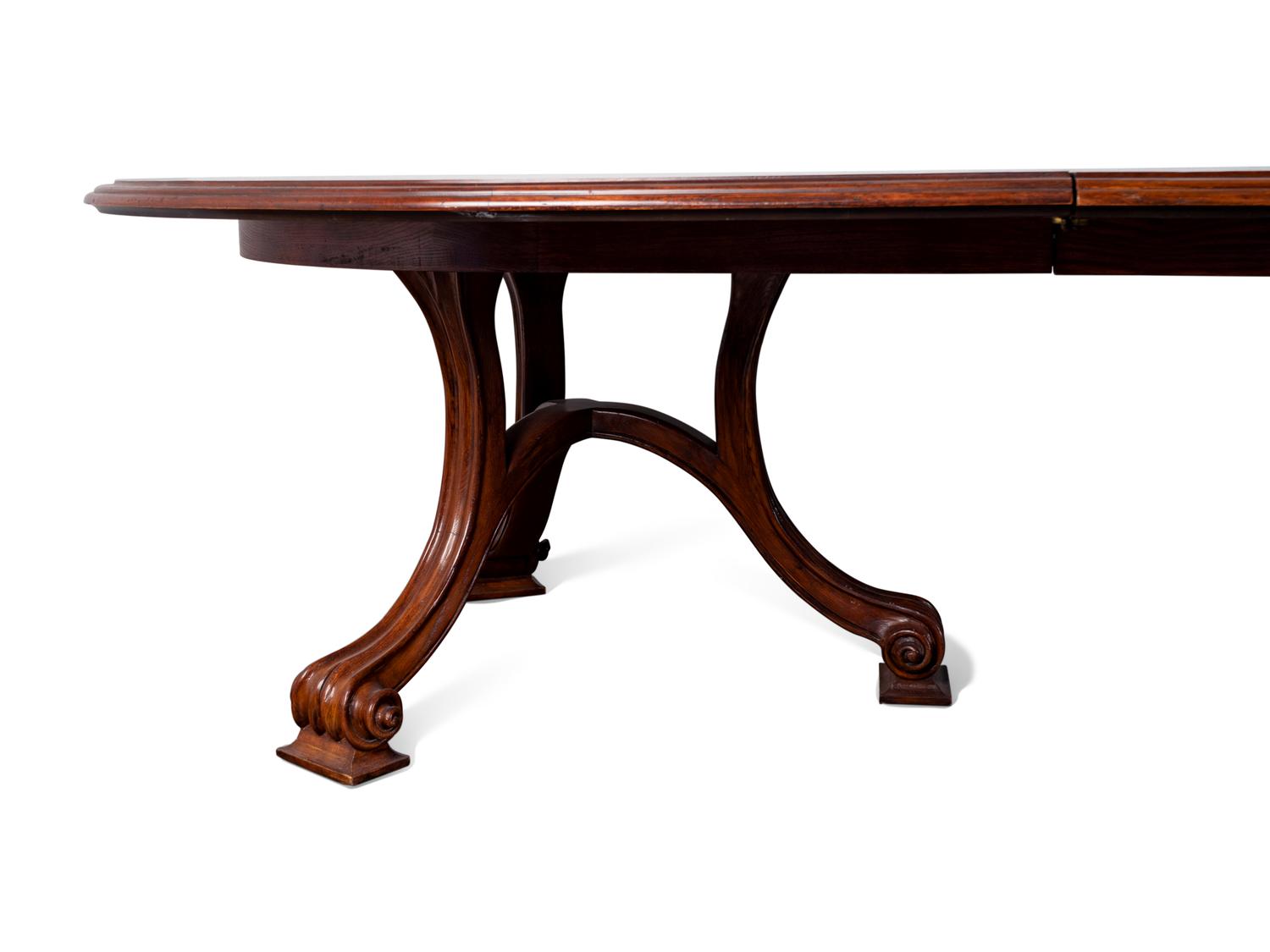 A Carved Walnut Two Pedestal Banquet Table by Therien Studio Workshops — 20TH CENTURY