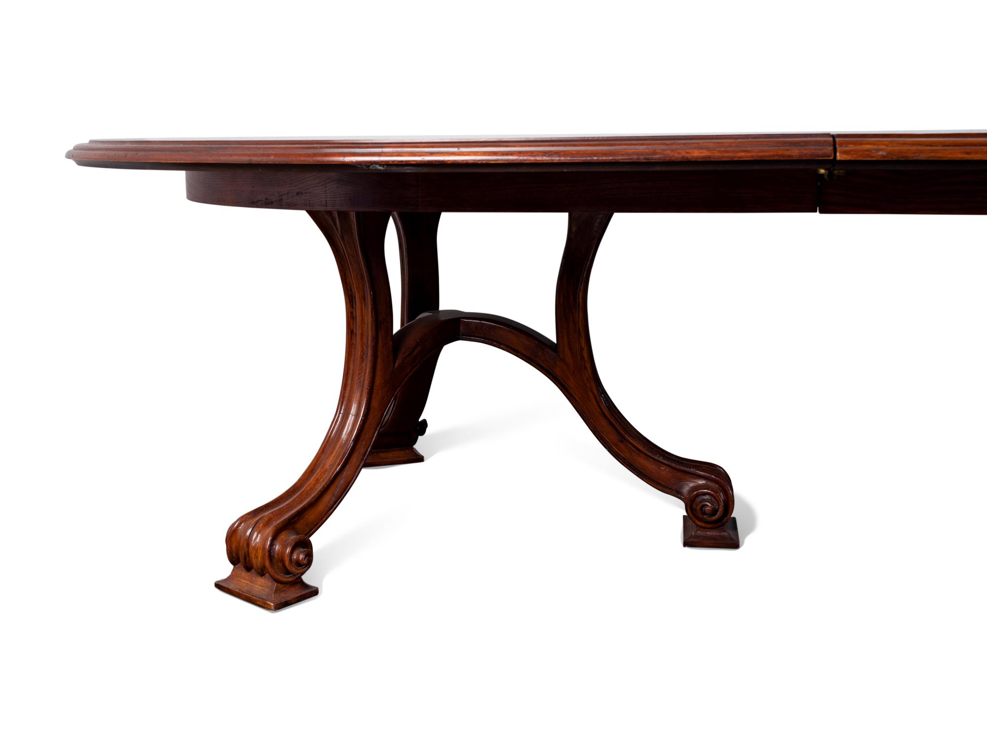 A Carved Walnut Two Pedestal Banquet Table by Therien Studio Workshops — 20TH CENTURY