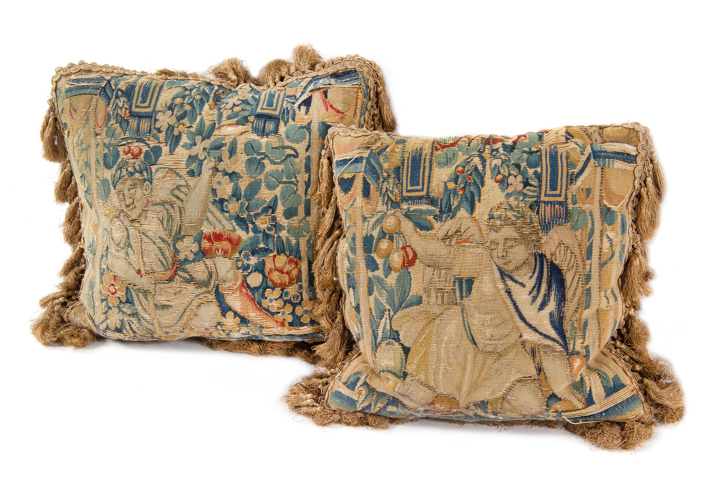 A Pair of Flemish Tapestry Pillows Height 14 x width 14 inches. — INCORPORATING 17TH CENTURY TAPESTRY