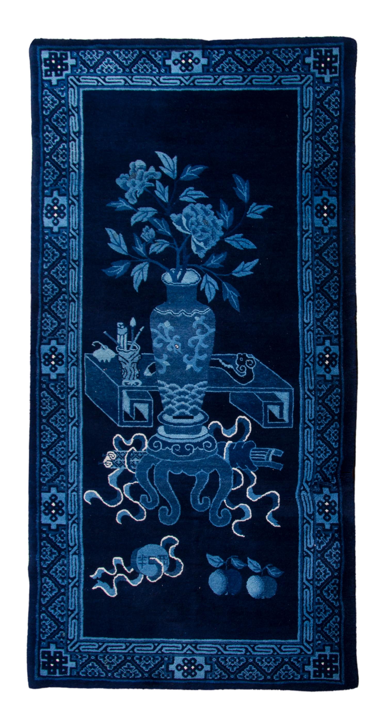 A Chinese Wool Rug, 3 feet 2 inches x 6 feet 2 inches.