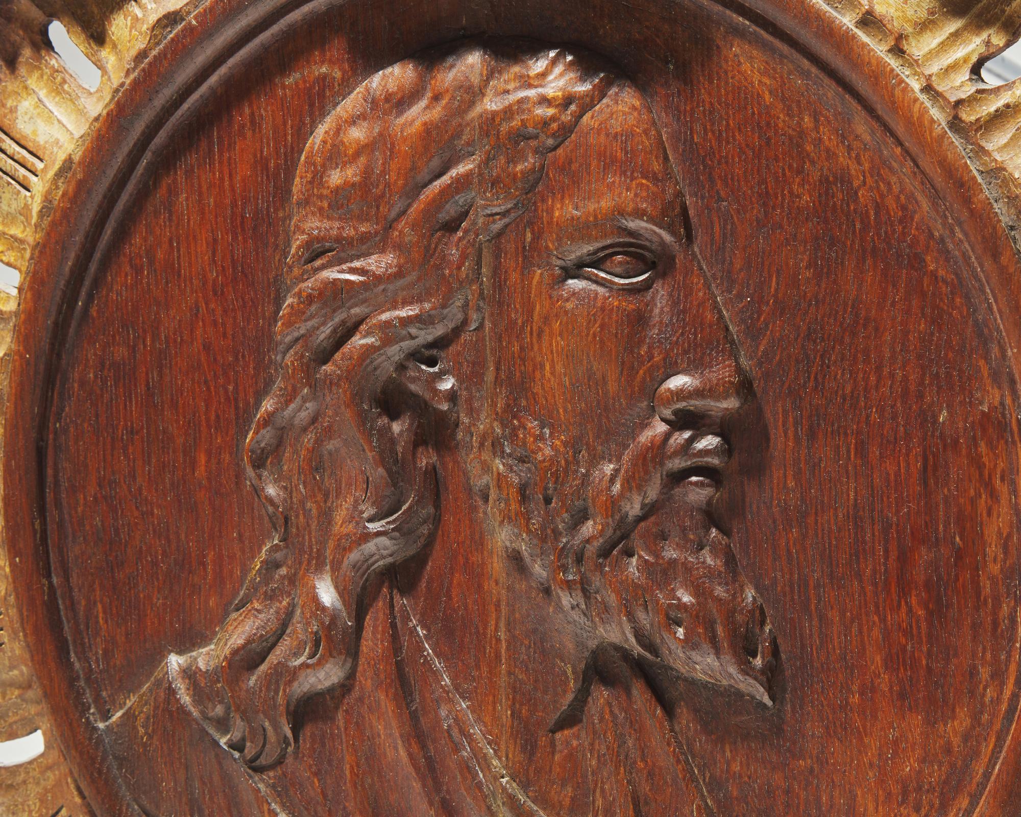 A Flemish carved oak bas relief profile portrait of Christ, 17th century