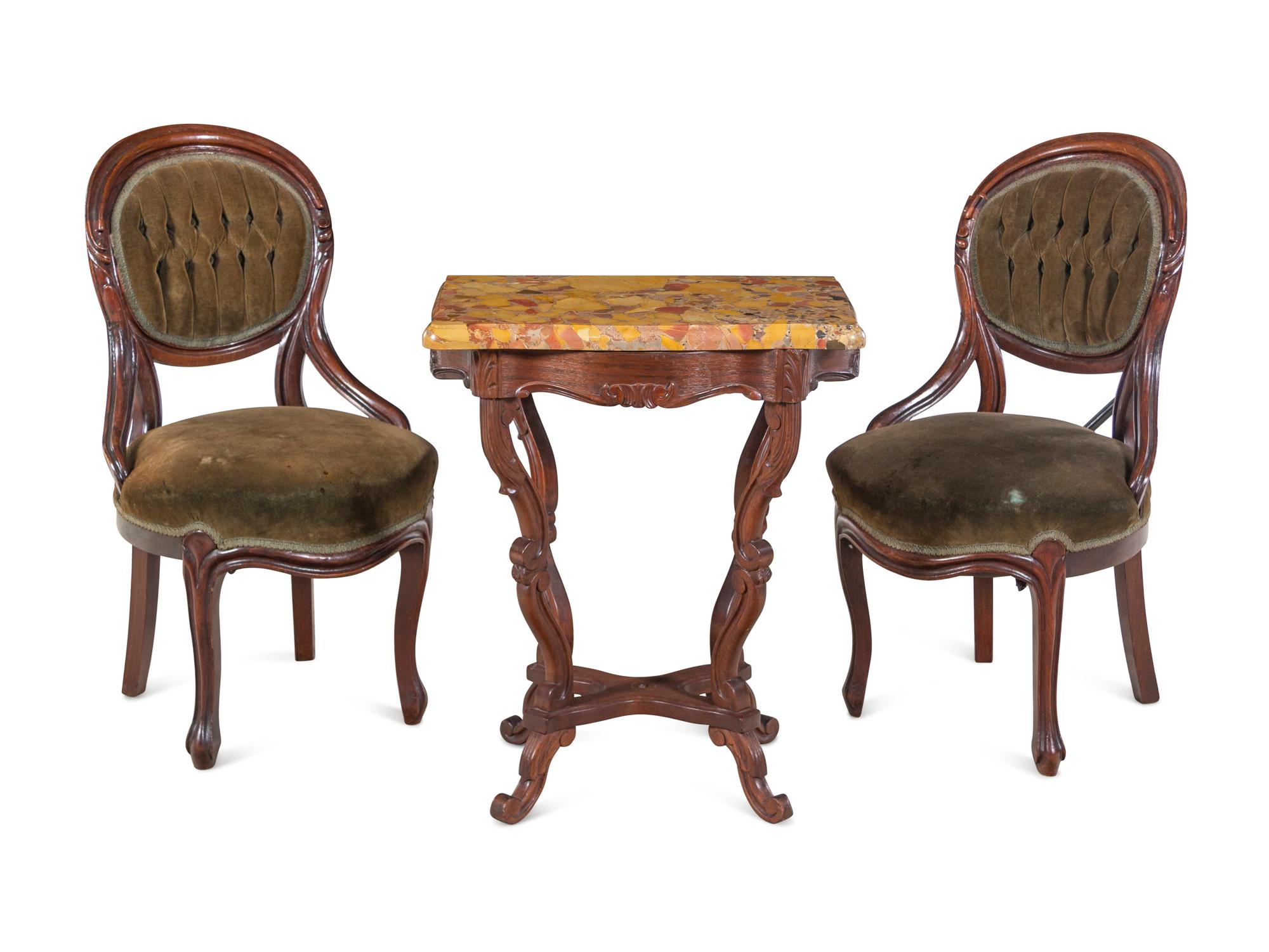 A Pair of Victorian Rococo Revival Walnut Side Chairs and a Victorian Side Table
