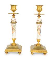 A Pair of French Gilt Bronze and Painted Porcelain Candlesticks