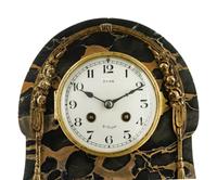 A Continental Gilt Bronze Mounted Marble Mantel Clock
