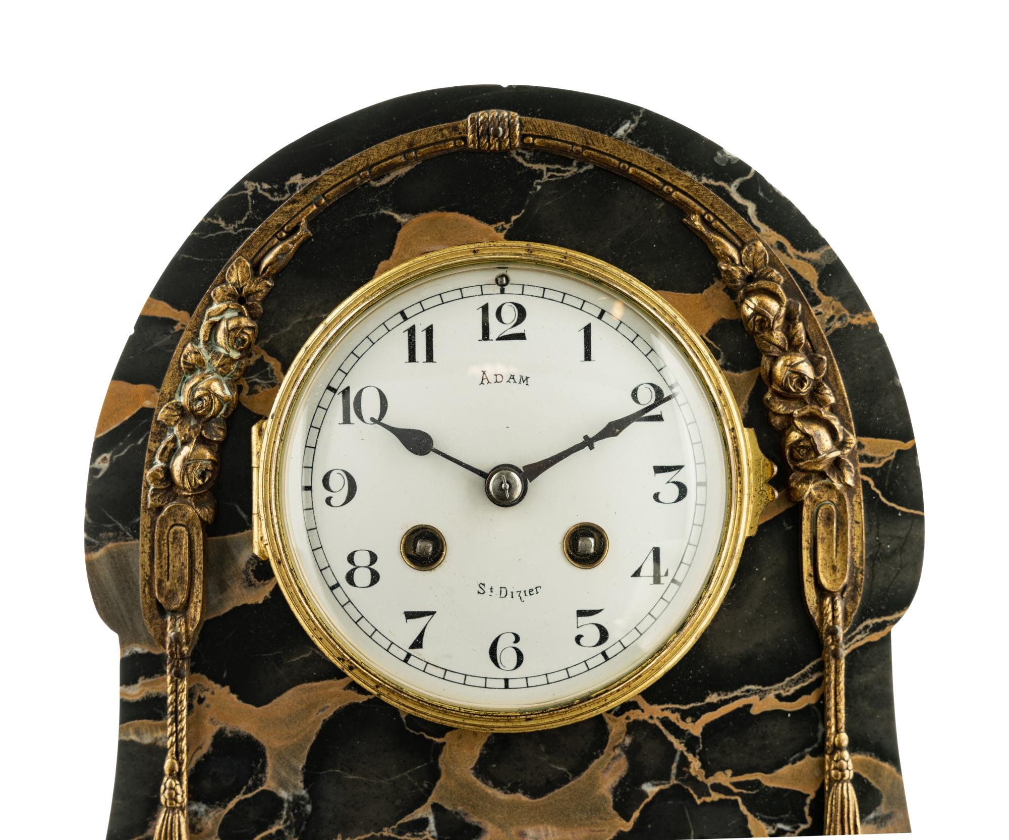 A Continental Gilt Bronze Mounted Marble Mantel Clock