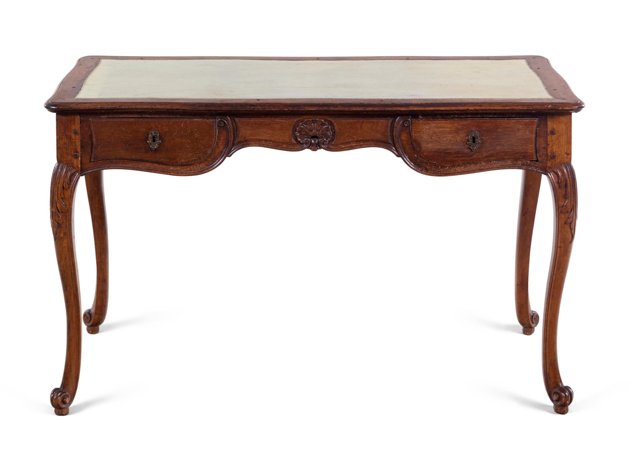 A Continental Leather-Inset Walnut Writing Table
