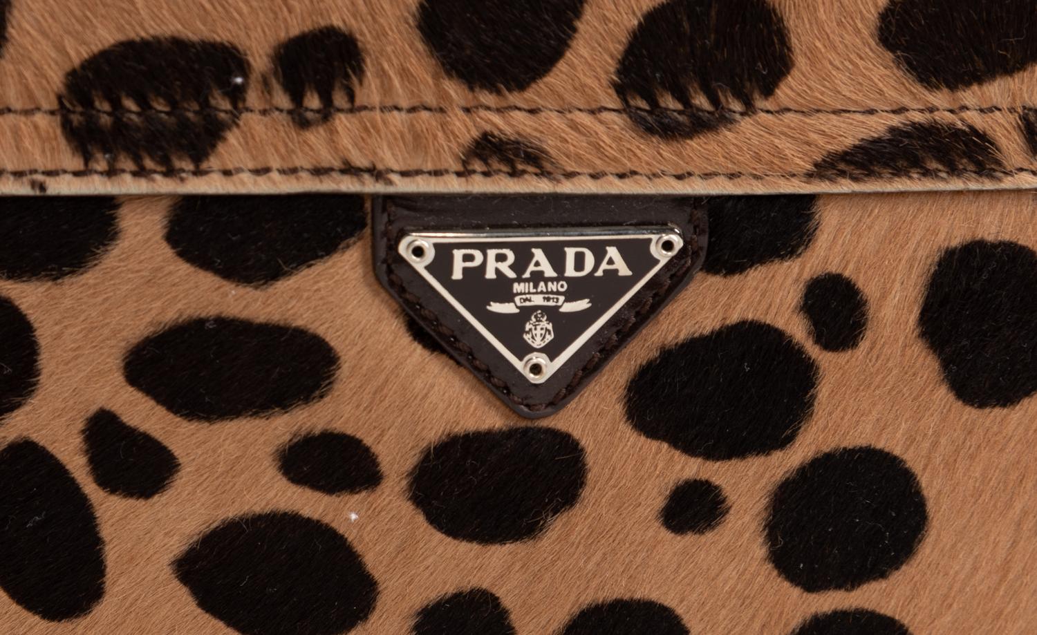 Two Designer Pony Hair Bags: One Céline Leopard Print Tote and One Prada Animal Print Clutch