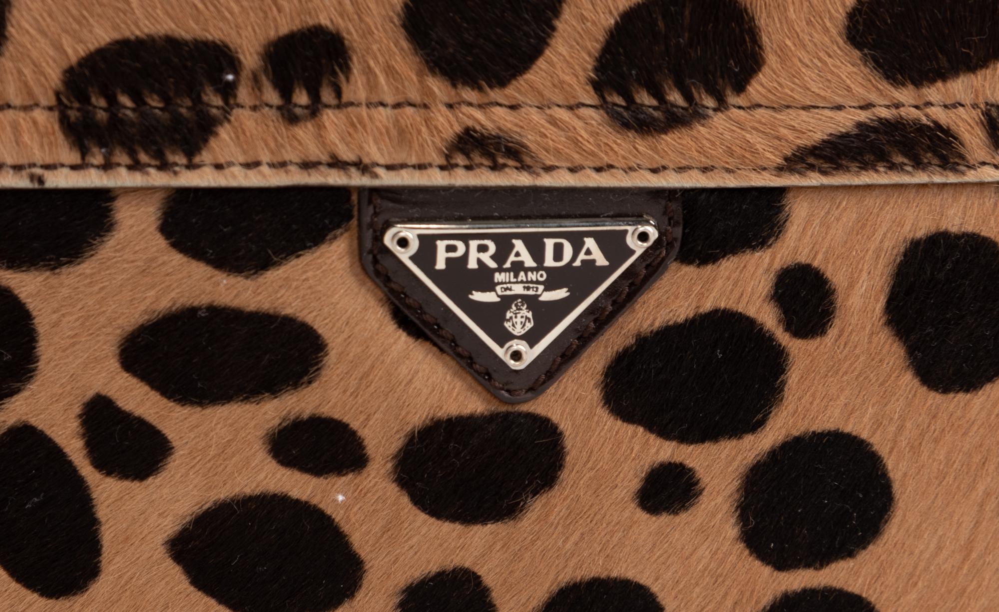 Two Designer Pony Hair Bags: One Céline Leopard Print Tote and One Prada Animal Print Clutch