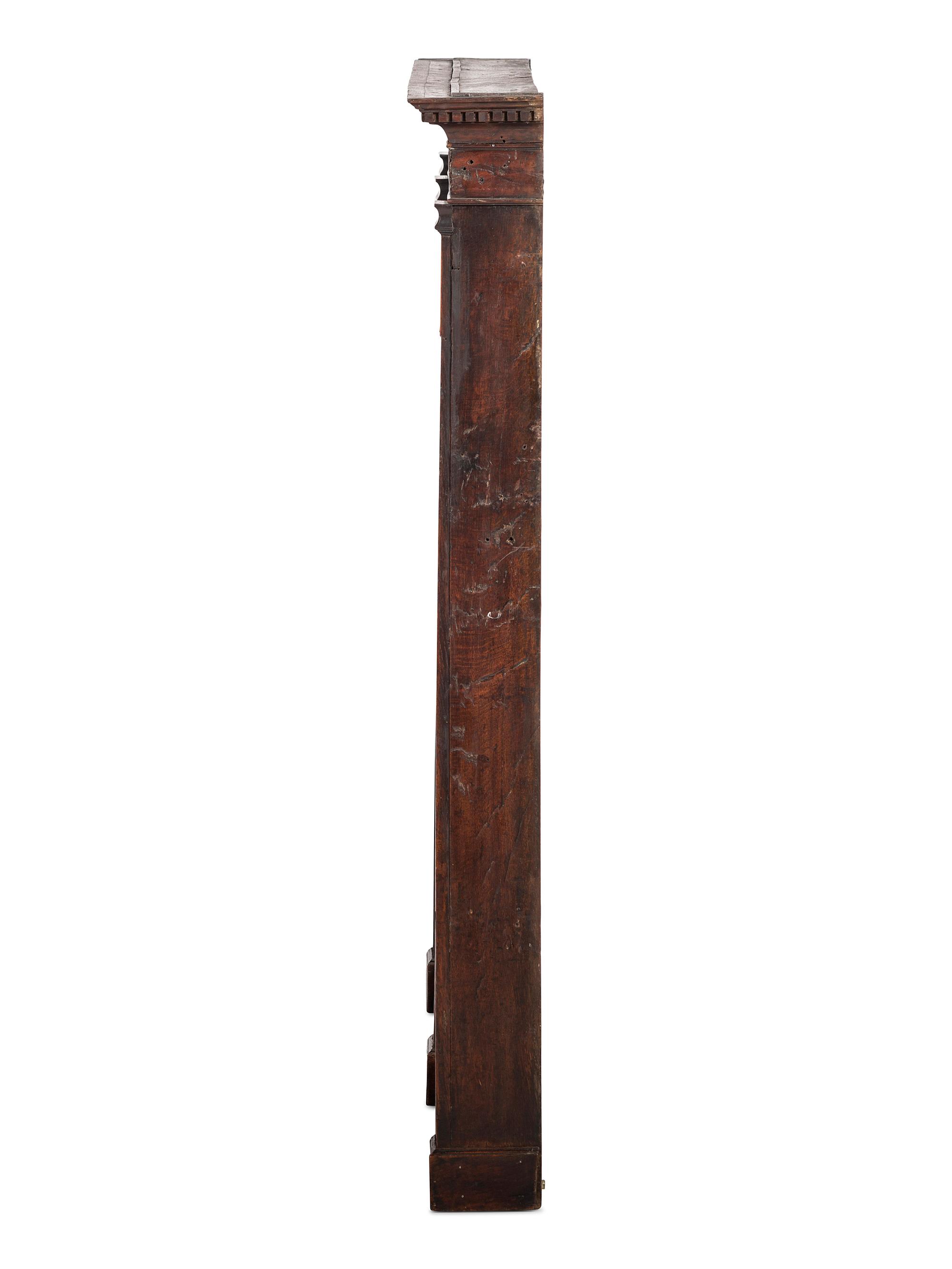 A Regency Inlaid and Carved Walnut Hanging Pewter Rack