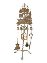 A Mizner Wrought Iron Fireplace Stand with Five Implements