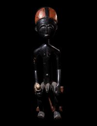 An Akan Wood Figure Seated on a Throne