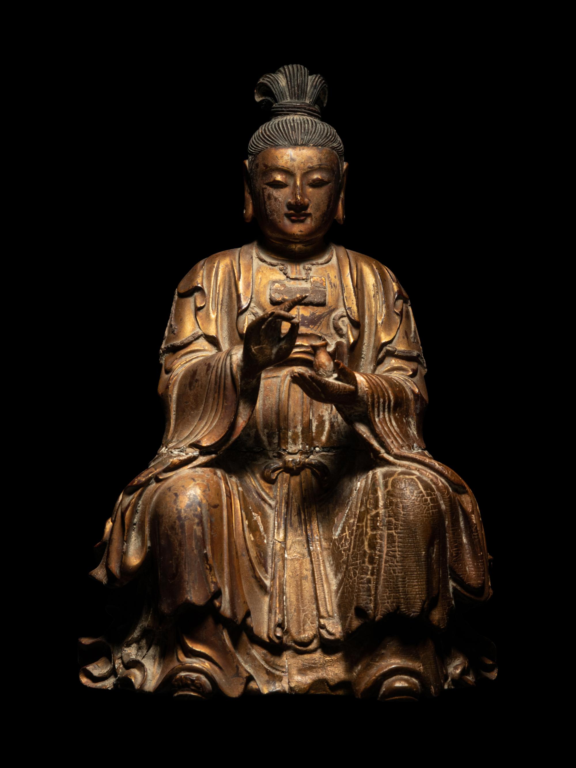 A Gilt Wood Figure of Seated Guanyin