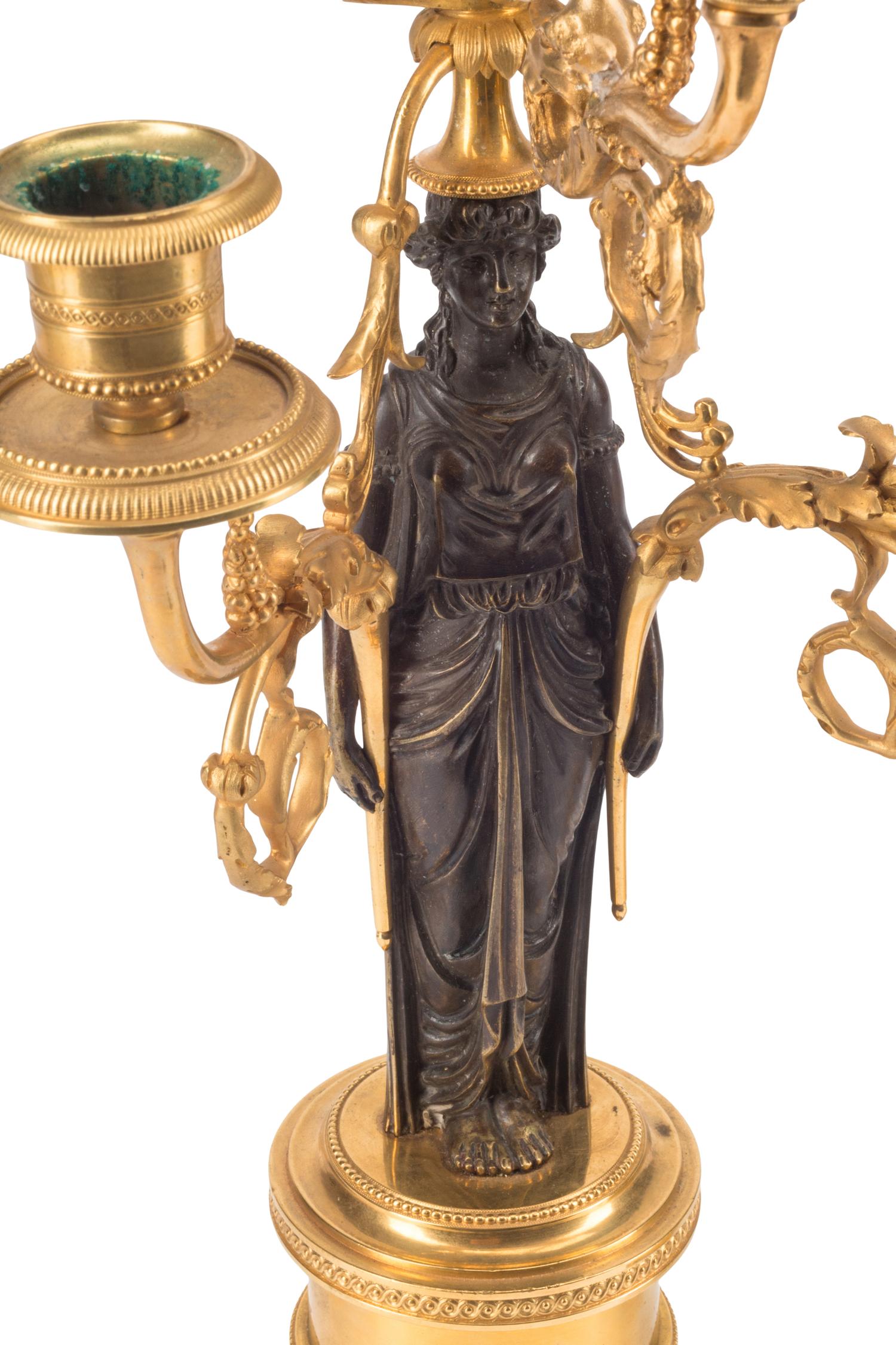 An Empire Gilt and Patinated Bronze Clock Garniture