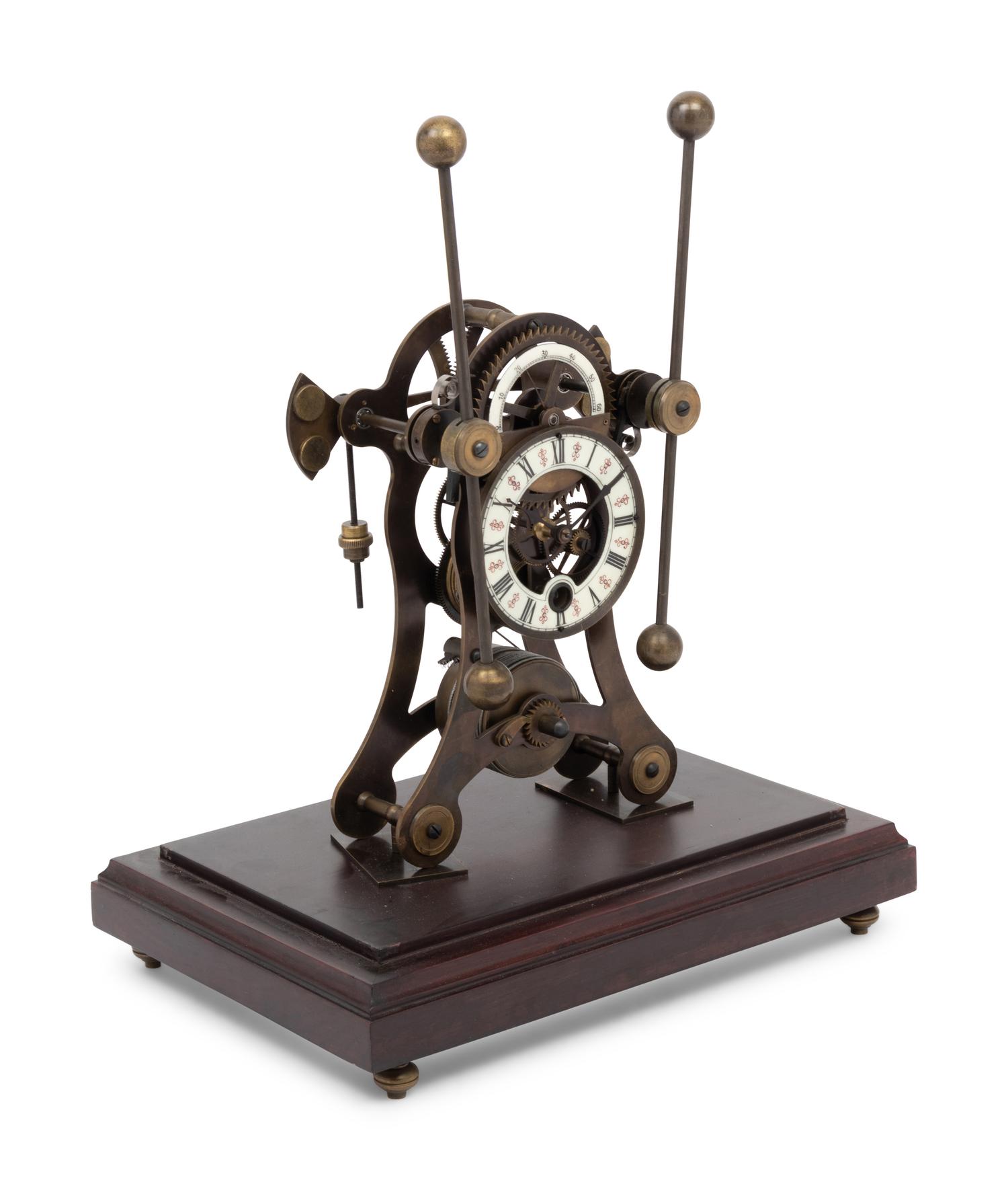 A Continental Cased Brass Skeleton Clock