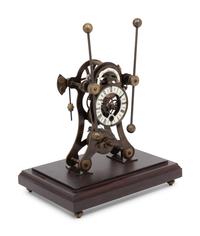 A Continental Cased Brass Skeleton Clock