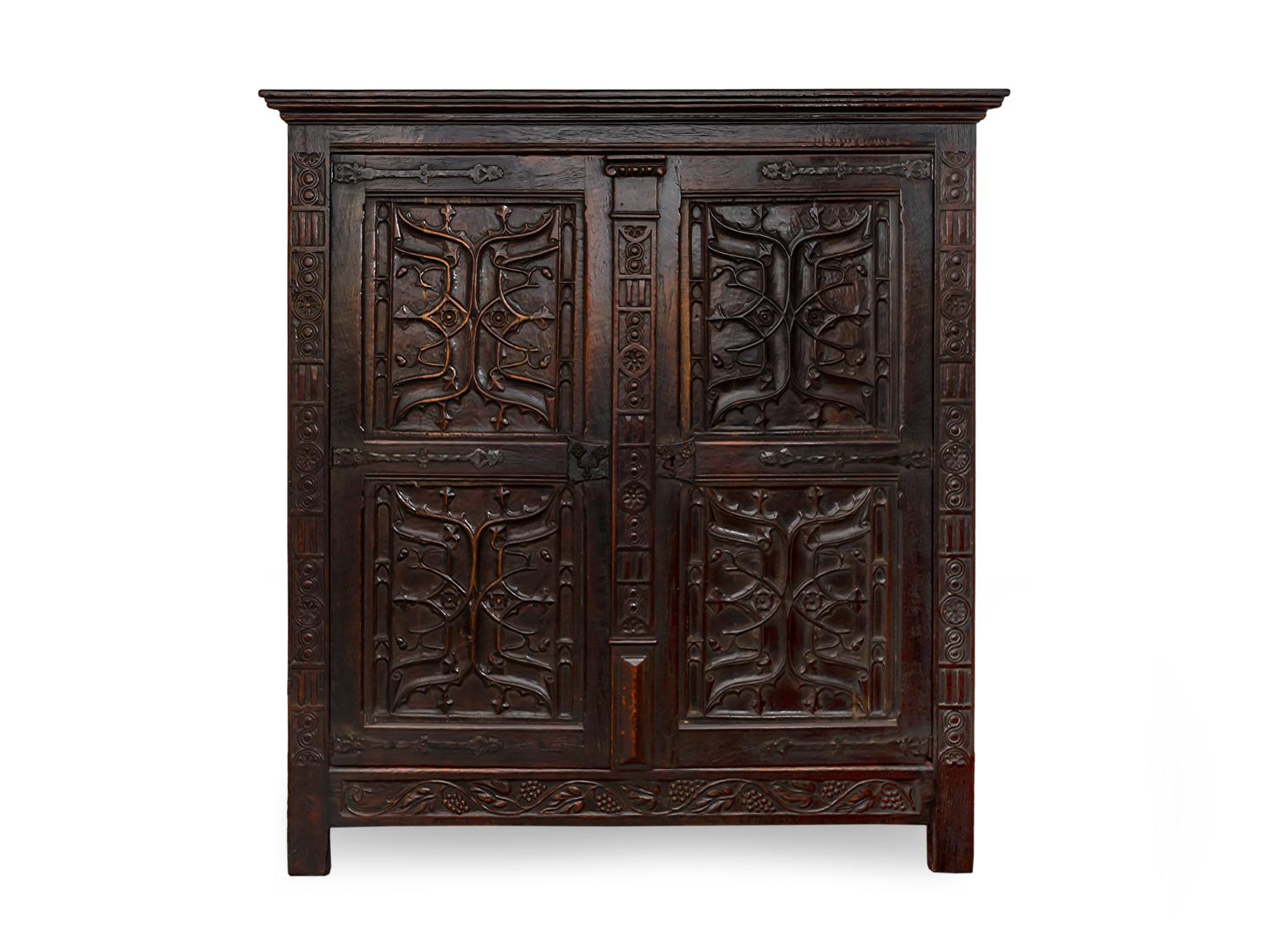 A Renaissance Revival Carved and Stained Oak Kas — 19TH CENTURY