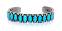 Three Southwestern Silver and Turquoise Cuff Bracelets Length of largest 5 1/2 x opening 1 1/2 inches.