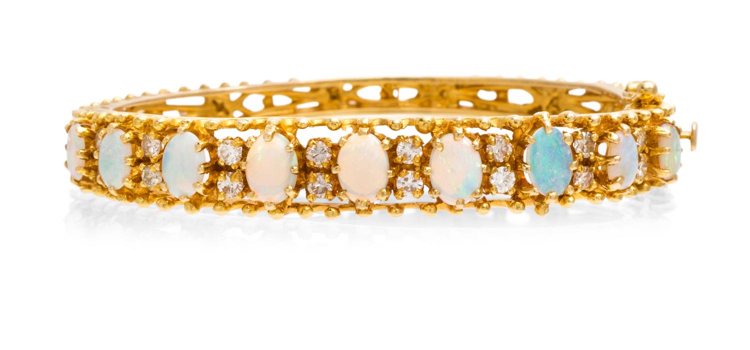 A 14 Karat Yellow Gold, Opal and Diamond Bangle Bracelet, 15.40 dwts.