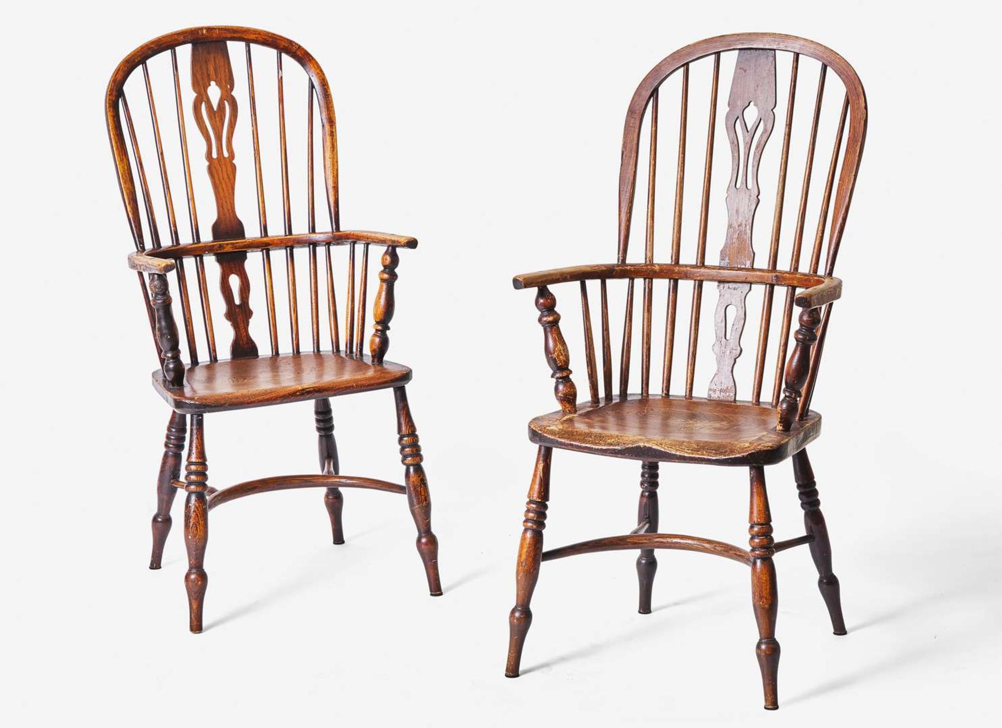 A pair of English provincial carved elm and ash Windsor armchairs, 19th century