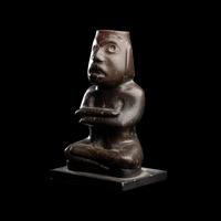 A Group of Twelve Pre-Colombian Style and Near Eastern Style Carved Stone Articles