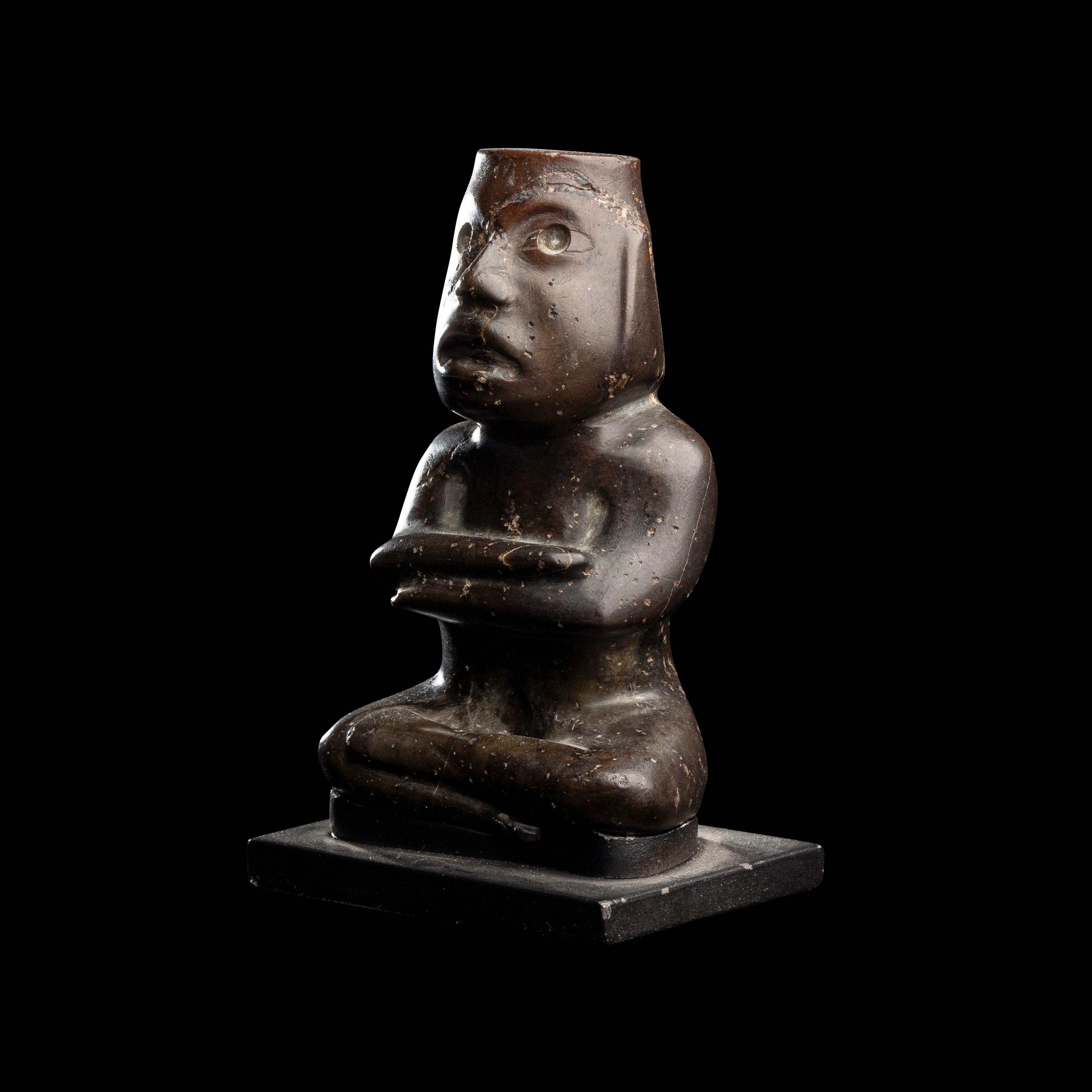A Group of Twelve Pre-Colombian Style and Near Eastern Style Carved Stone Articles