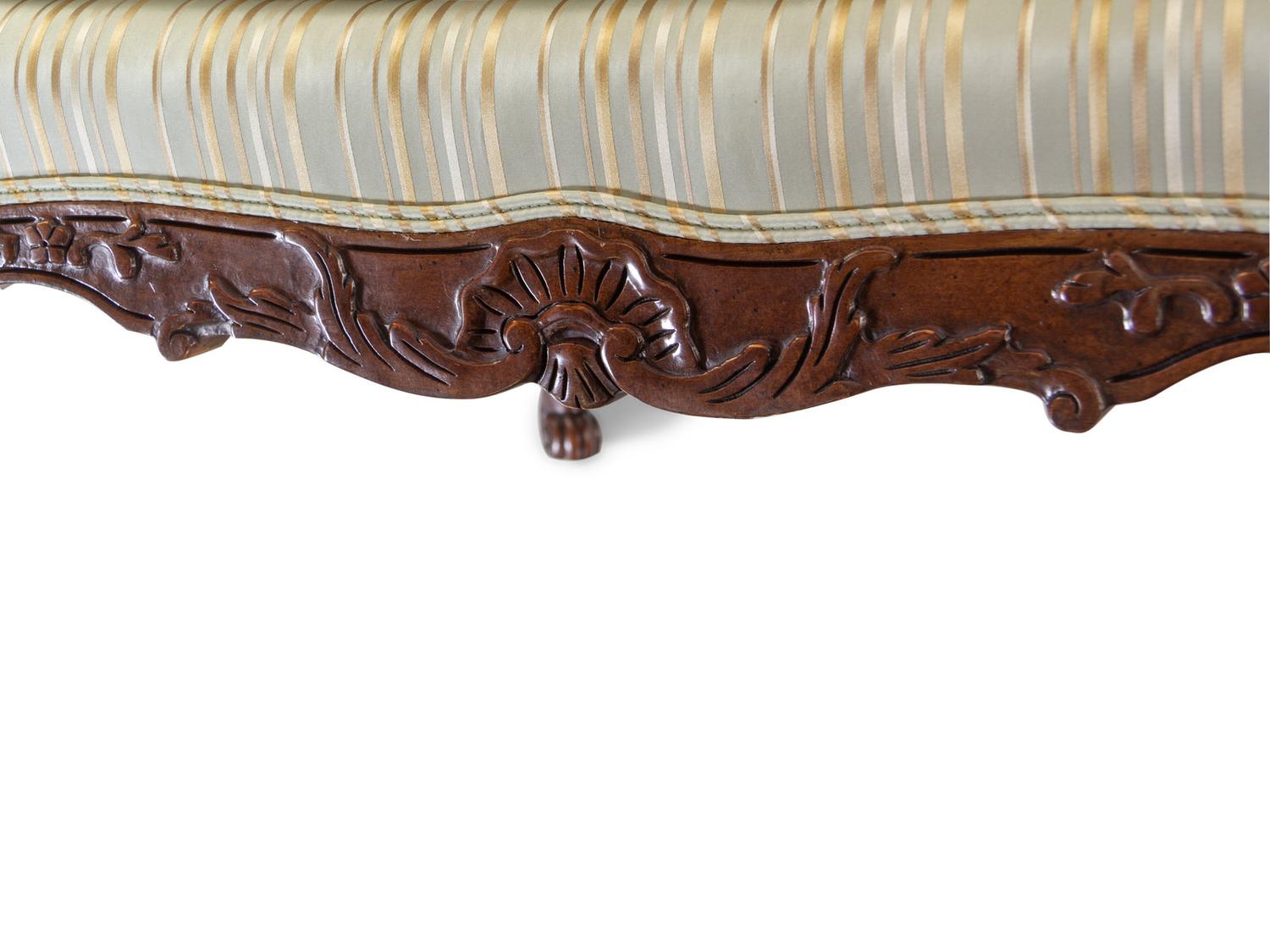 A Pair of Louis XV Style Carved Walnut Fauteuils
