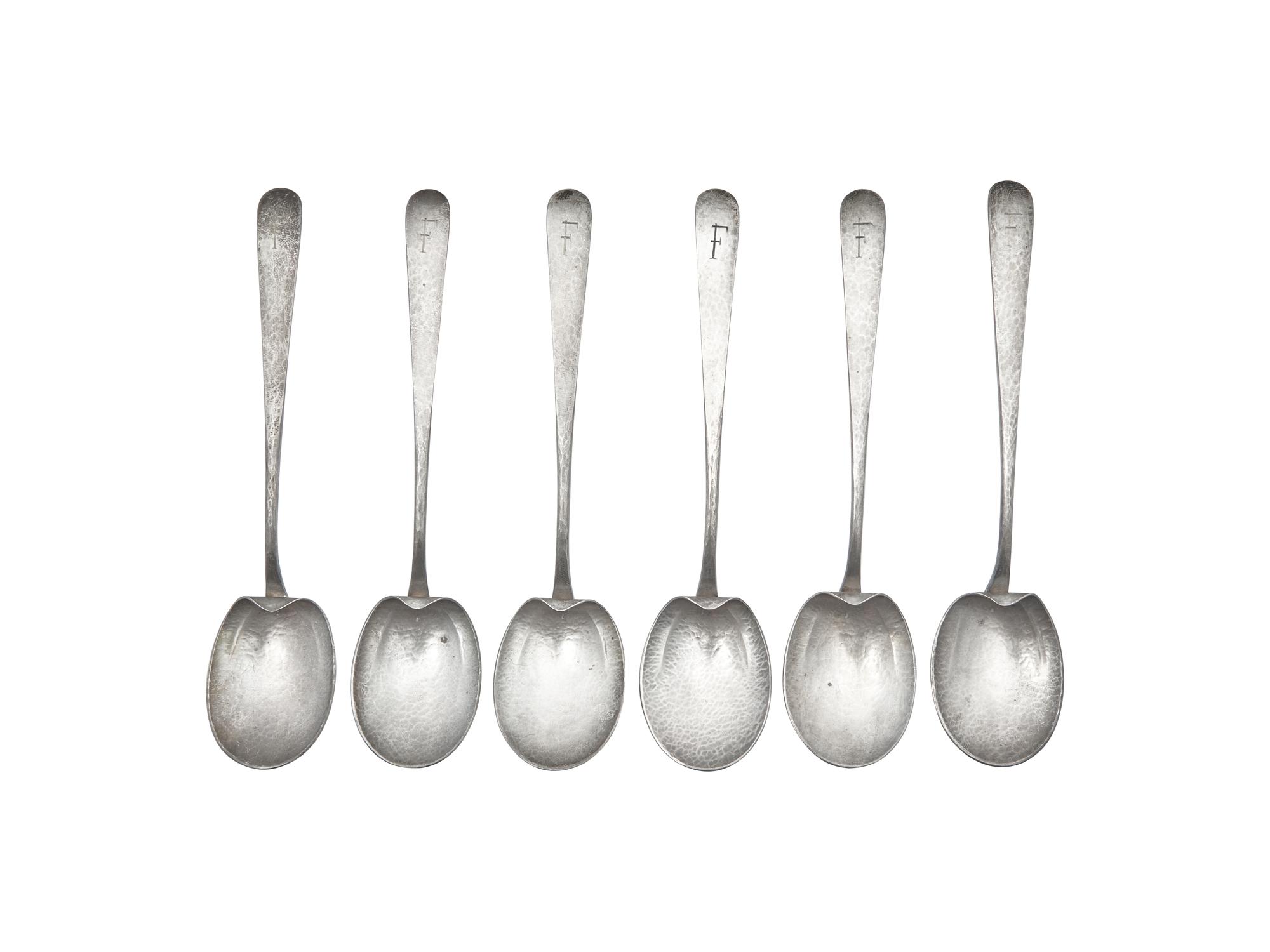 A Set of Six Arts & Crafts Hammered Silver Teaspoons