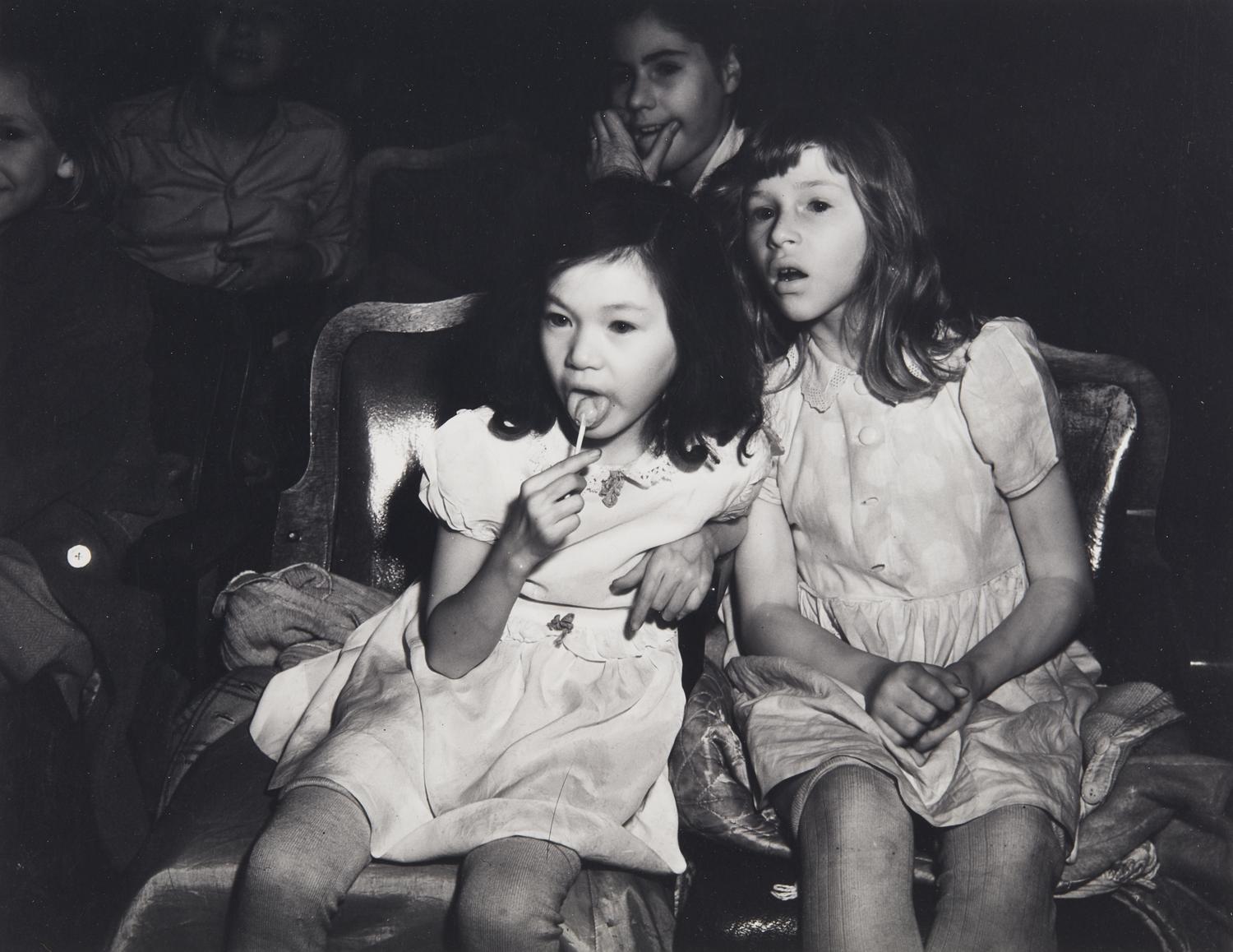 Weegee (1899-1968) Palace Theatre, New York City (Two girls with lollipops), 1950s