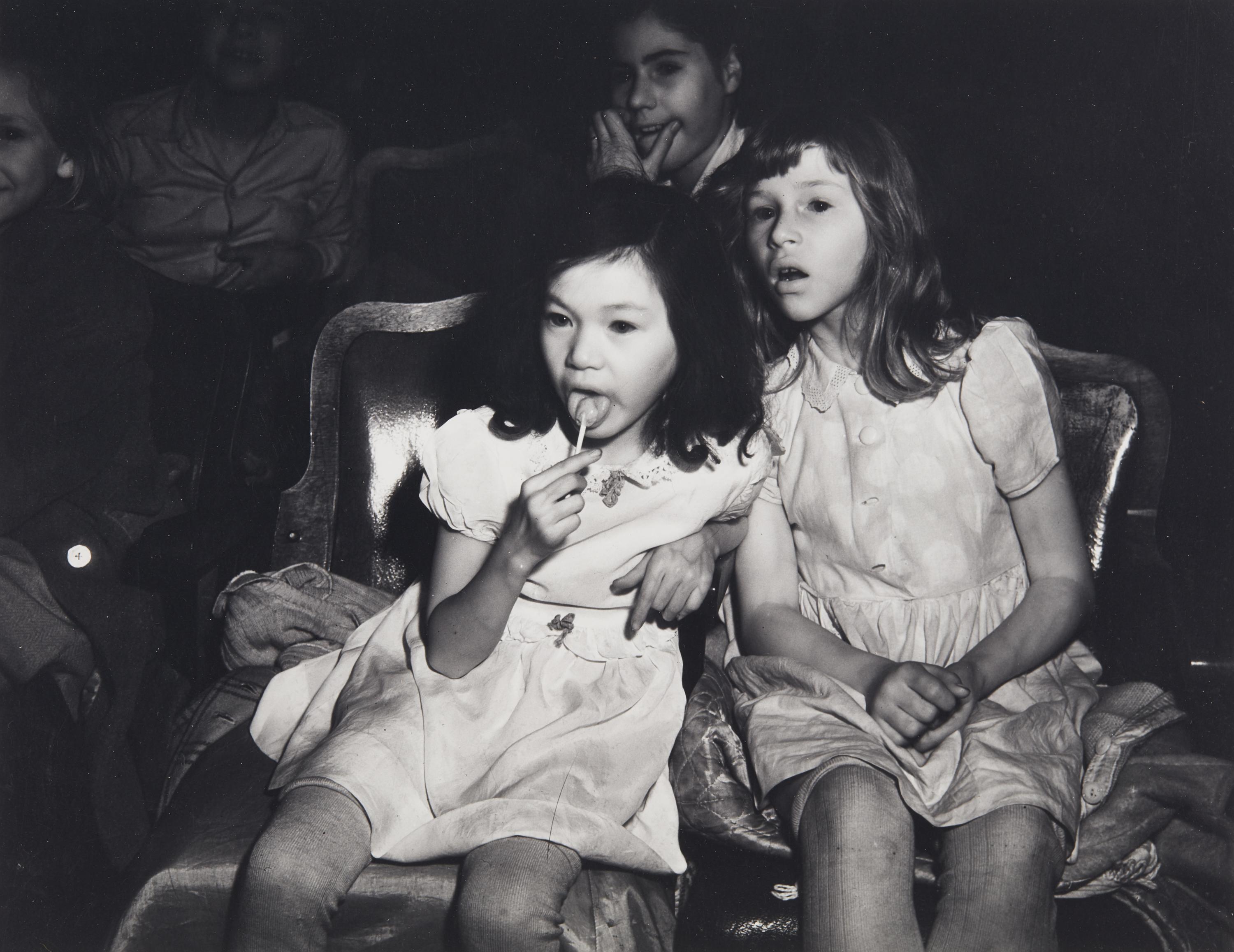 Weegee (1899-1968) Palace Theatre, New York City (Two girls with lollipops), 1950s
