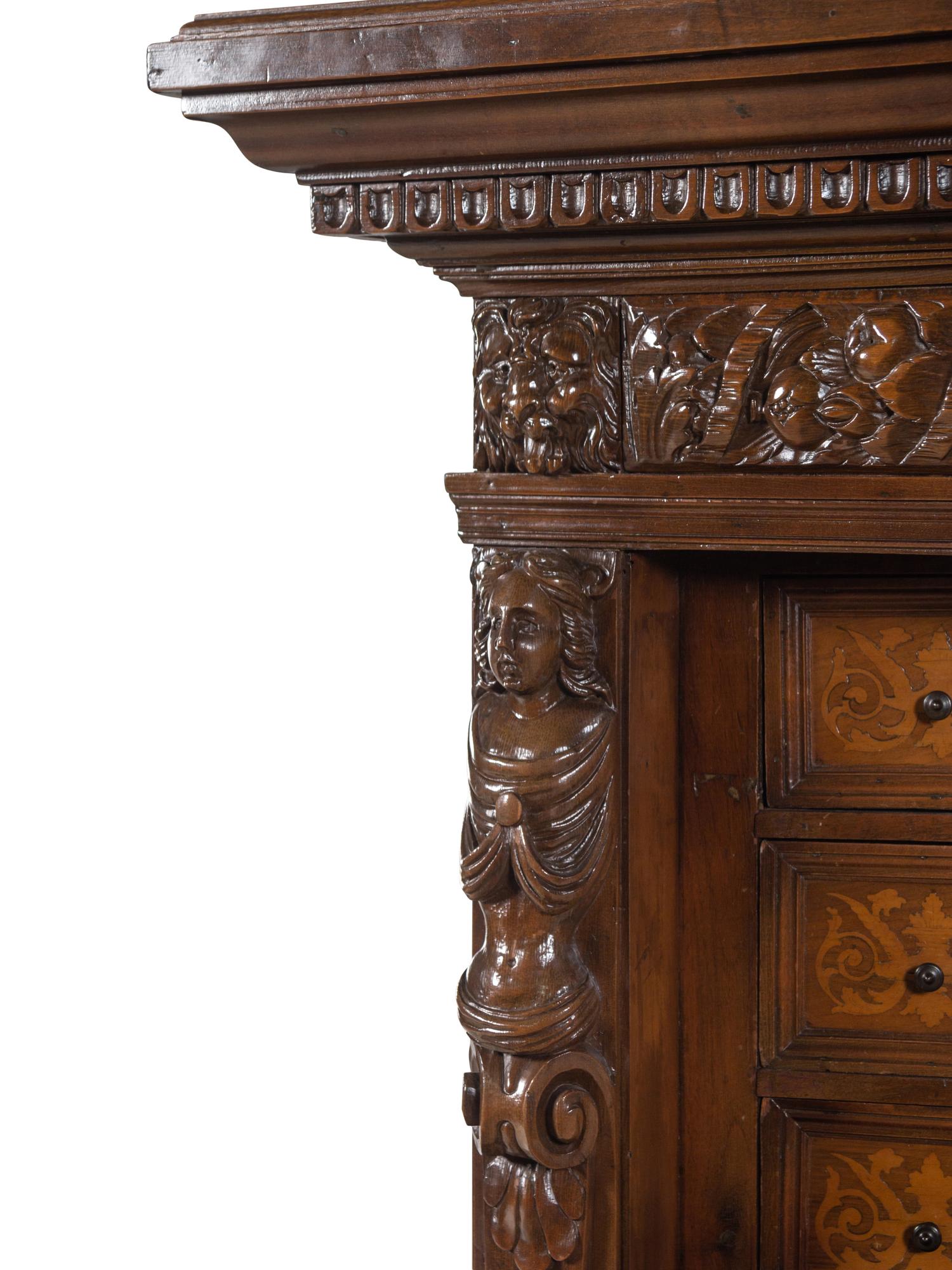 A Renaissance Revival Carved Walnut and Marquetry Collector's Cabinet