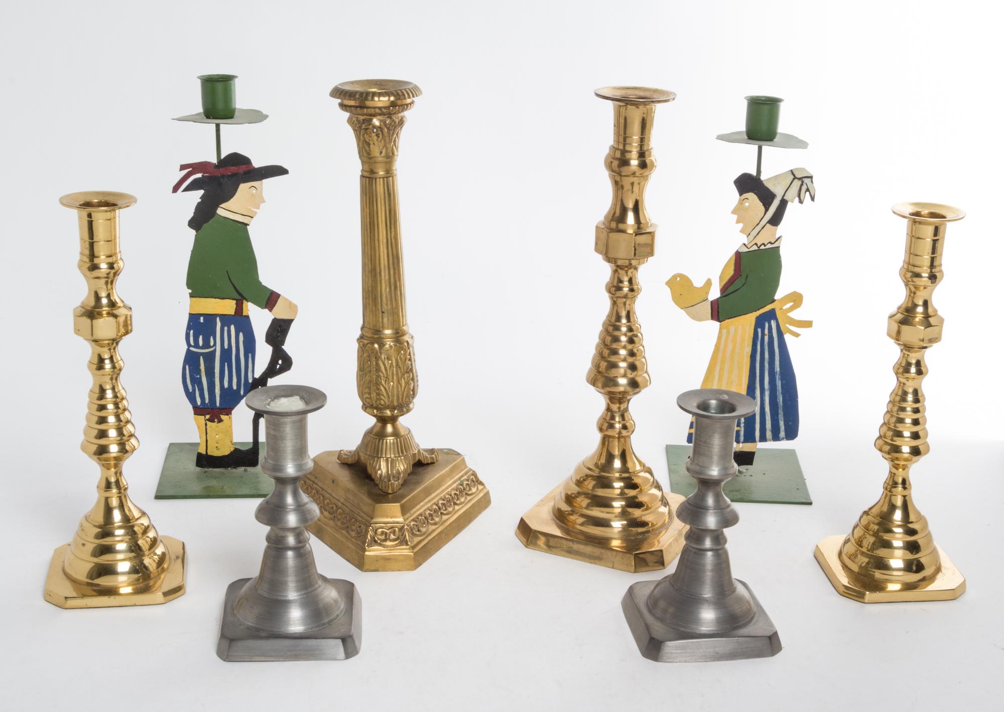 A Group of Eight Candlesticks Height of tallest 12 inches.