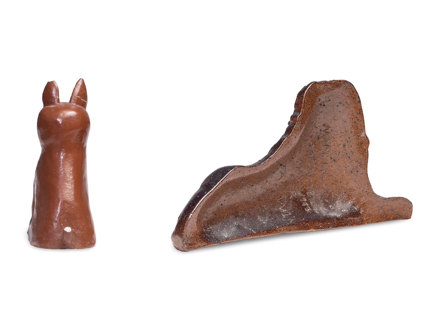 A Glazed Sewer Tile Recumbent Lion Doorstop