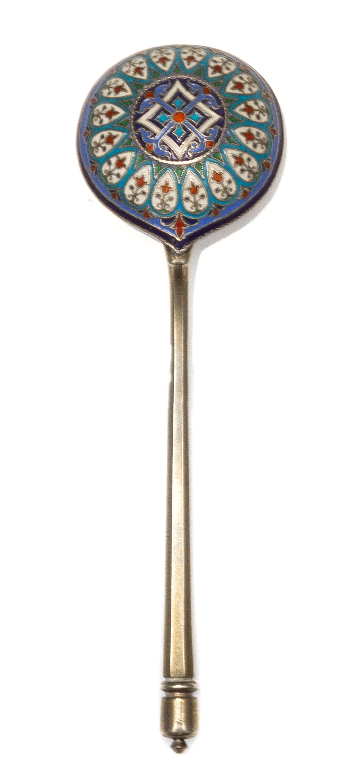 A Russian Silver-Gilt and Enamel Spoon, Mark of Ivan Khlebnikov, assay mark of Viktor Savinsky, Moscow, 1888, having a finial topped ha