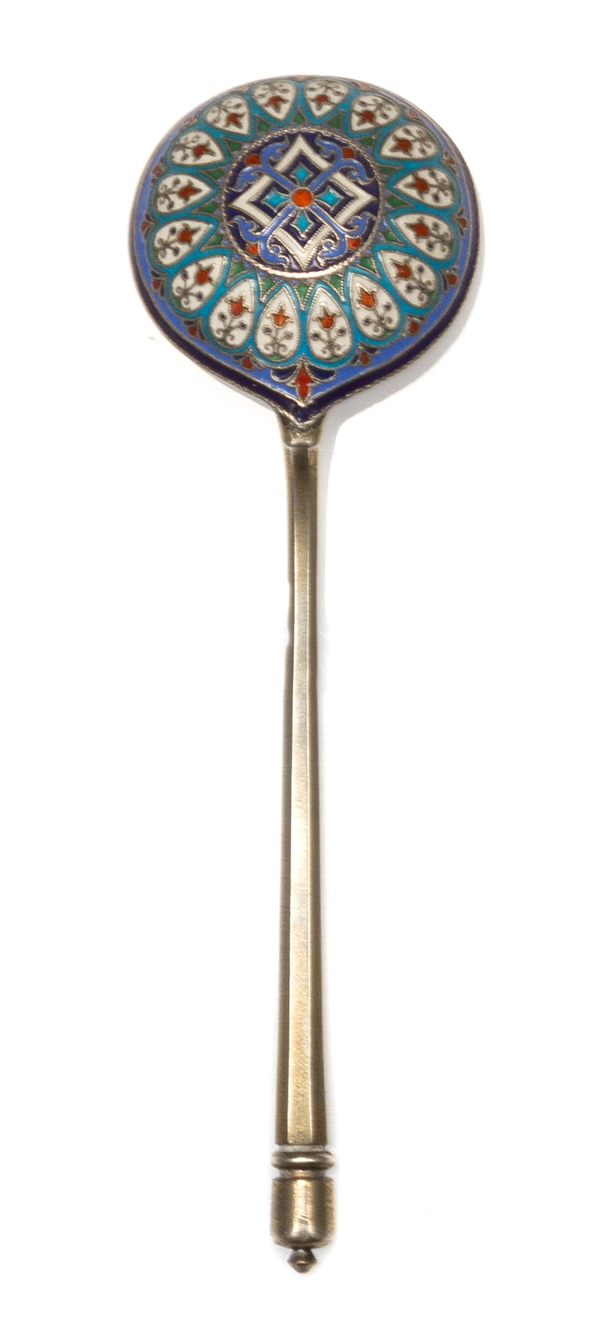 A Russian Silver-Gilt and Enamel Spoon, Mark of Ivan Khlebnikov, assay mark of Viktor Savinsky, Moscow, 1888, having a finial topped ha